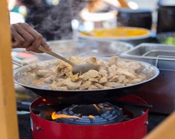 A street vendor preparing food