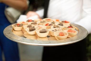 A person serving food at an event.
